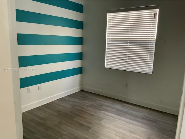 5220 NW 48th Ln, Tamarac, FL 33319 - spare room with baseboards and wood finished floors