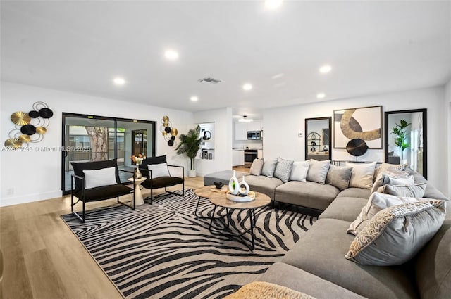 679 SW 17th Ct, Boca Raton, FL 33486 - living room with wood finished floors and recessed lighting
