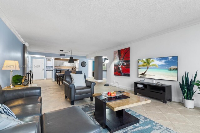 3725 S Ocean Dr Unit 1224, Hollywood, FL 33019 - living area featuring ornamental molding, light tile patterned flooring, a textured ceiling, and baseboards