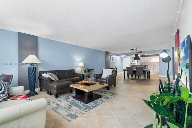3725 S Ocean Dr Unit 1224, Hollywood, FL 33019 - living room with ornamental molding, a textured ceiling, and light tile patterned floors