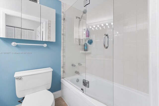 3725 S Ocean Dr Unit 1224, Hollywood, FL 33019 - bathroom with toilet, enclosed tub / shower combo, and baseboards
