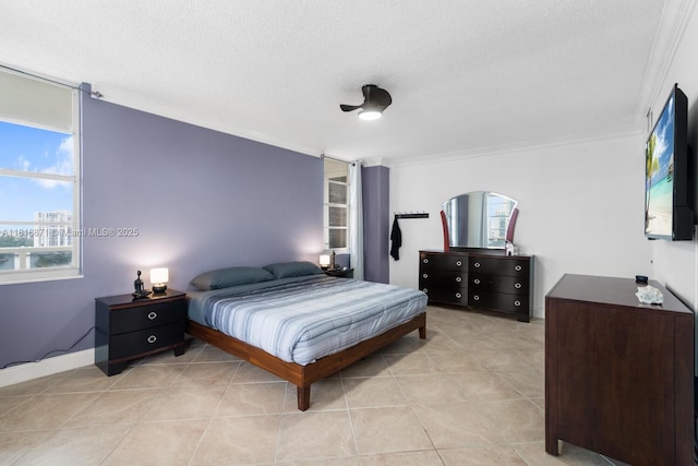 3725 S Ocean Dr Unit 1224, Hollywood, FL 33019 - bedroom with crown molding, a textured ceiling, light tile patterned flooring, and baseboards