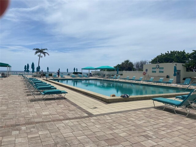 3725 S Ocean Dr Unit 1224, Hollywood, FL 33019 - community pool featuring a patio