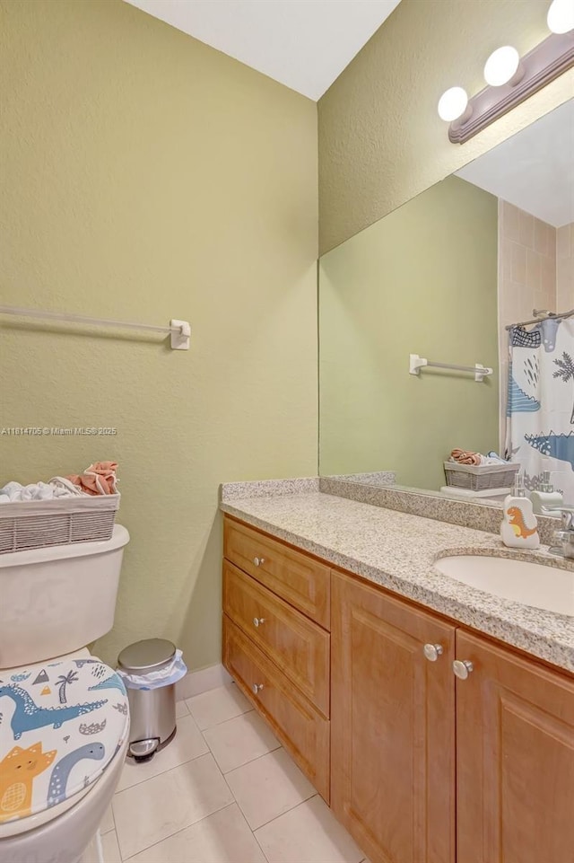 14521 SW 29th Ter Unit 14521, Miami, FL 33175 - bathroom with vanity, tile patterned floors, a shower with curtain, and a textured wall