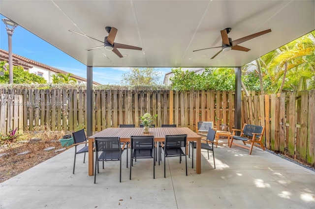 14521 SW 29th Ter Unit 14521, Miami, FL 33175 - fenced backyard with outdoor dining space, a ceiling fan, and a patio area