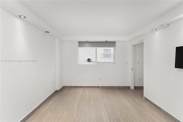 401 Ocean Dr Unit 221, Miami Beach, FL 33139 - empty room featuring recessed lighting, baseboards, and wood finished floors