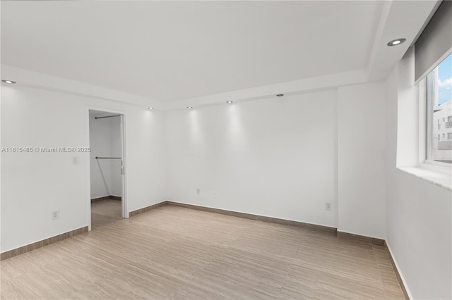 401 Ocean Dr Unit 221, Miami Beach, FL 33139 - unfurnished room with recessed lighting, baseboards, and light wood-type flooring