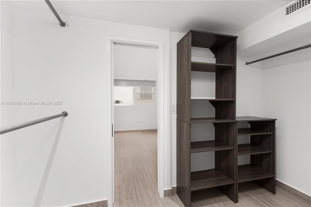 401 Ocean Dr Unit 221, Miami Beach, FL 33139 - spacious closet with light wood-style flooring