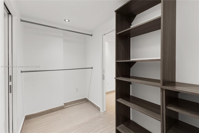 401 Ocean Dr Unit 221, Miami Beach, FL 33139 - walk in closet featuring light wood-style flooring