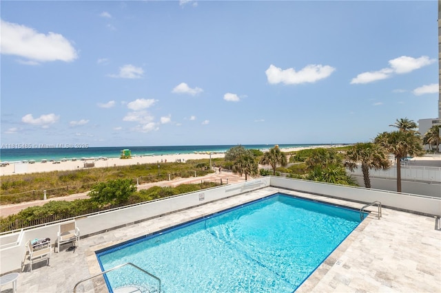 401 Ocean Dr Unit 221, Miami Beach, FL 33139 - community pool featuring view of water and beach and a patio