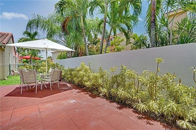18424 NW 21st St, Pembroke Pines, FL 33029 - fenced backyard featuring a patio area and outdoor dining space