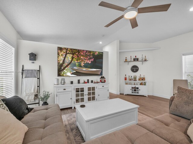 18424 NW 21st St, Pembroke Pines, FL 33029 - living area with light wood-style flooring, ceiling fan, recessed lighting, a bar, and baseboards