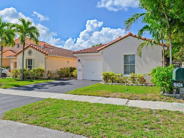 18424 NW 21st St, Pembroke Pines, FL 33029 - mediterranean / spanish home featuring an attached garage, stucco siding, driveway, and a tiled roof