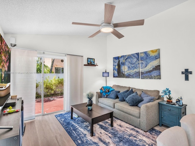 18424 NW 21st St, Pembroke Pines, FL 33029 - living area featuring lofted ceiling, light wood-style floors, ceiling fan, and a textured ceiling