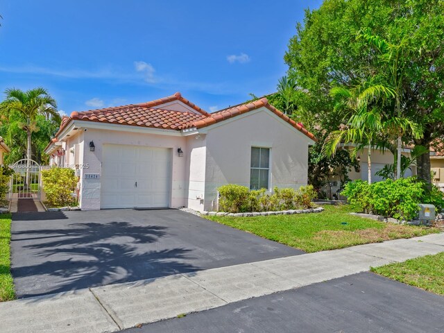 18424 NW 21st St, Pembroke Pines, FL 33029 - mediterranean / spanish house featuring a tiled roof, driveway, a garage, and stucco siding
