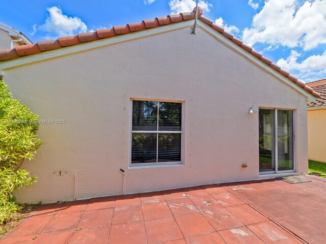 18424 NW 21st St, Pembroke Pines, FL 33029 - rear view of house with stucco siding, a patio area, and a tile roof