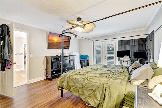 717 SW Aster Rd, Port St Lucie, FL 34953 - bedroom with wood finished floors, crown molding, baseboards, access to outside, and a ceiling fan