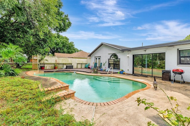 717 SW Aster Rd, Port St Lucie, FL 34953 - view of swimming pool featuring a patio