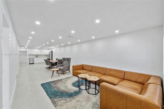 3655 Stirling Rd, Hollywood, FL 33312 - living room with recessed lighting and baseboards