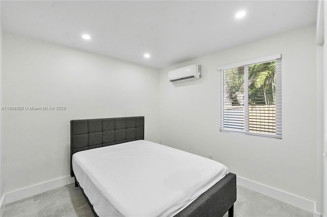 3655 Stirling Rd, Hollywood, FL 33312 - bedroom with an AC wall unit, recessed lighting, and baseboards