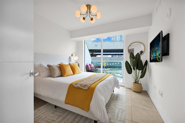 41 SE 5th St Unit 517, Miami, FL 33131 - tiled bedroom featuring a chandelier and access to outside
