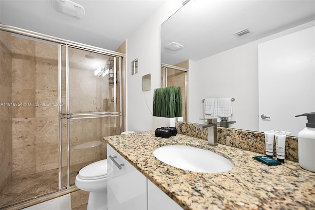41 SE 5th St Unit 517, Miami, FL 33131 - full bath with vanity, a shower stall, and toilet