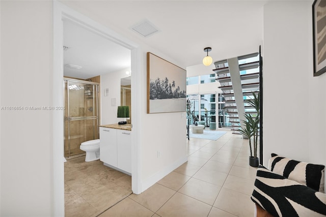 41 SE 5th St Unit 517, Miami, FL 33131 - hall featuring light tile patterned floors and expansive windows