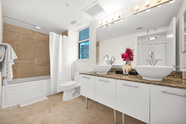 41 SE 5th St Unit 517, Miami, FL 33131 - bathroom featuring double vanity, shower / tub combo with curtain, toilet, and tile patterned floors