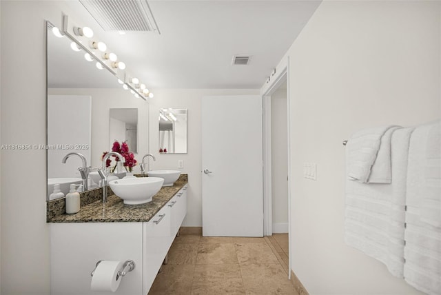 41 SE 5th St Unit 517, Miami, FL 33131 - full bath with double vanity and baseboards