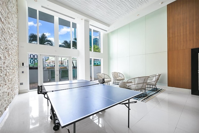 41 SE 5th St Unit 517, Miami, FL 33131 - rec room with a high ceiling, tile patterned floors, and french doors