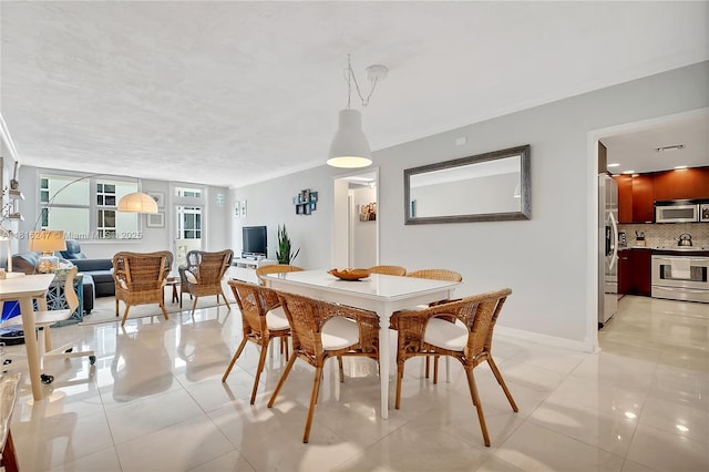 4250 Galt Ocean Dr Unit 7D, Fort Lauderdale, FL 33308 - dining space featuring light tile patterned floors and baseboards