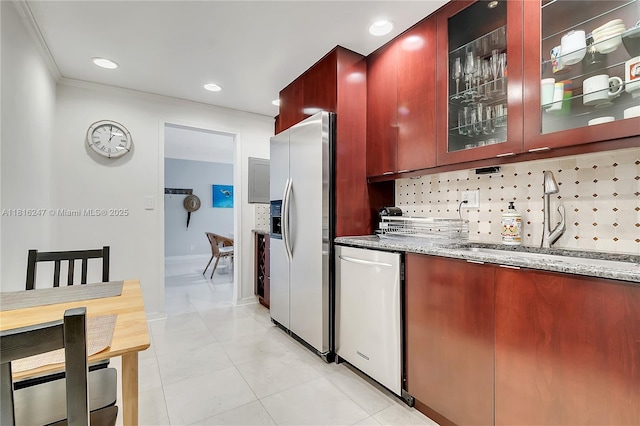 4250 Galt Ocean Dr Unit 7D, Fort Lauderdale, FL 33308 - kitchen with stainless steel appliances, light stone counters, decorative backsplash, and recessed lighting