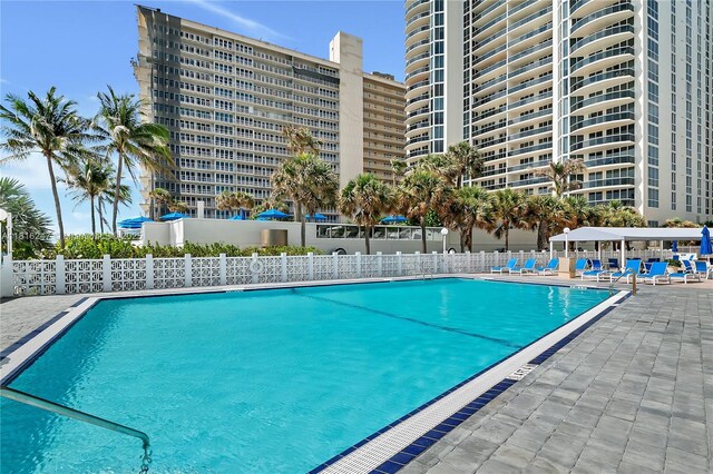 4250 Galt Ocean Dr Unit 7D, Fort Lauderdale, FL 33308 - community pool with a patio