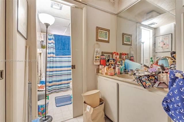 8635 NW 8th St Unit 104, Miami, FL 33126 - full bath with vanity, curtained shower, and tile patterned flooring