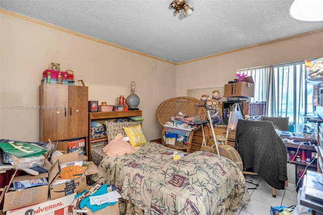 8635 NW 8th St Unit 104, Miami, FL 33126 - bedroom with ornamental molding, tile patterned flooring, and a textured ceiling