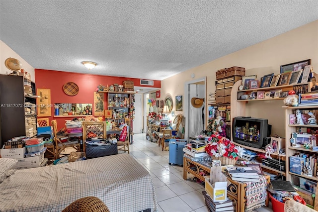 8635 NW 8th St Unit 104, Miami, FL 33126 - living room featuring tile patterned floors and a textured ceiling