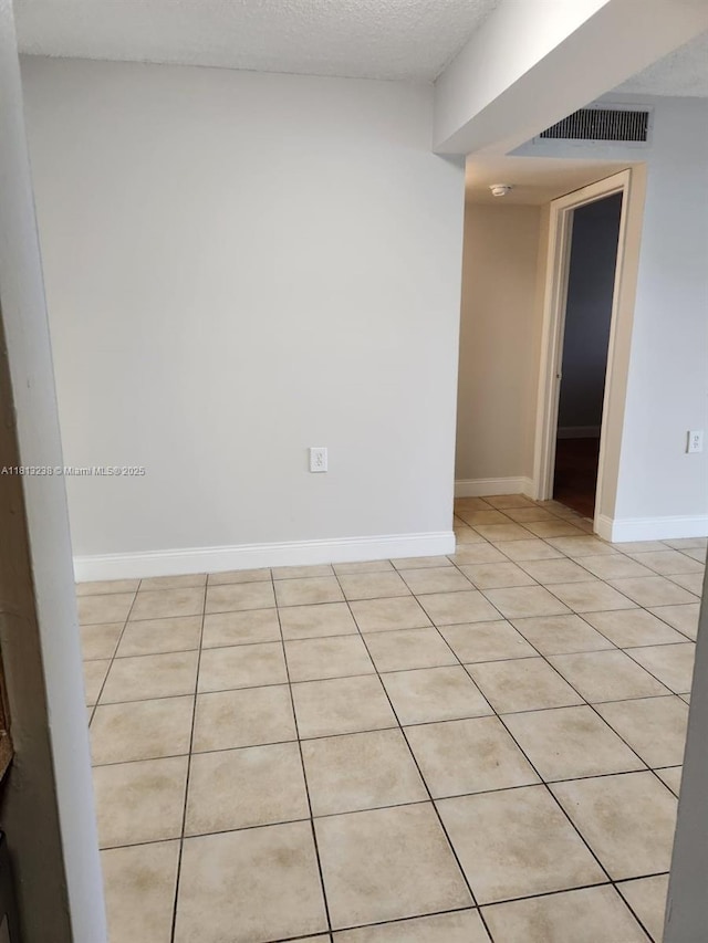 7095 NW 179th St Unit 206, Hialeah, FL 33015 - unfurnished room featuring light tile patterned floors and baseboards