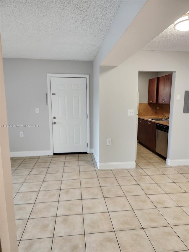 7095 NW 179th St Unit 206, Hialeah, FL 33015 - foyer entrance featuring a textured ceiling, baseboards, and light tile patterned floors