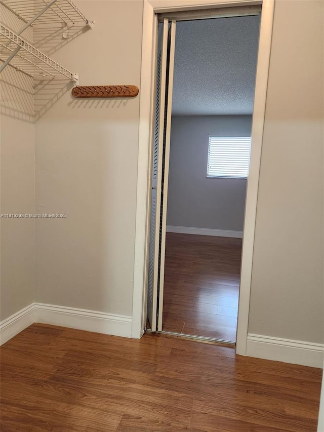 7095 NW 179th St Unit 206, Hialeah, FL 33015 - spacious closet featuring wood finished floors