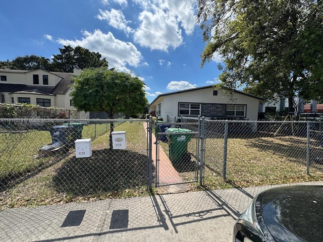 1226 NE 112th St, Miami, FL 33161 - view of front facade featuring a gate