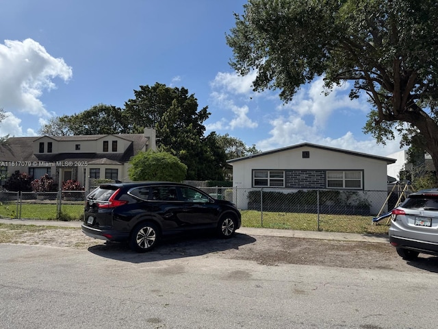 1226 NE 112th St, Miami, FL 33161 - view of front of home with stucco siding and uncovered parking