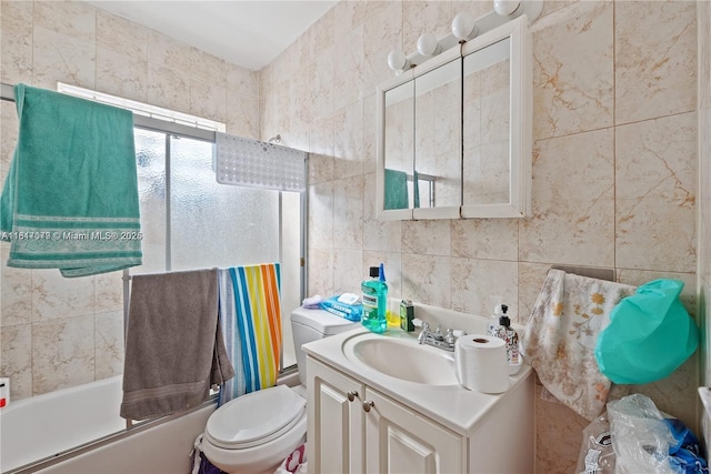 1226 NE 112th St, Miami, FL 33161 - bathroom featuring tile walls, vanity, toilet, and shower / bath combination with glass door