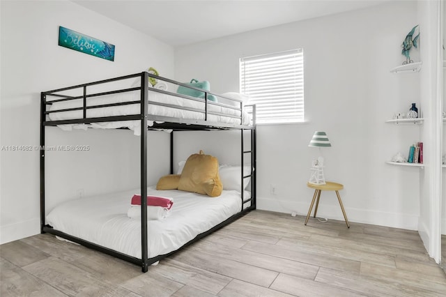 1547 NE 38th St, Oakland Park, FL 33334 - bedroom with wood finished floors and baseboards