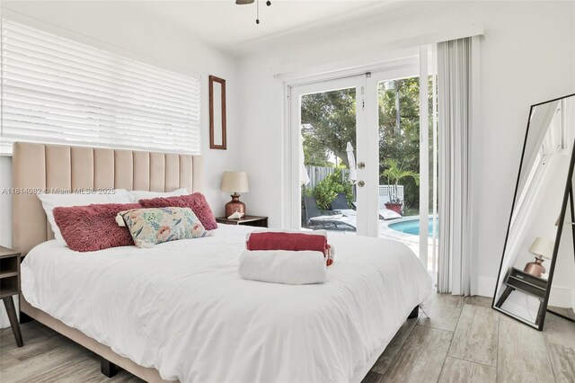 1547 NE 38th St, Oakland Park, FL 33334 - bedroom with access to outside, light wood-style floors, and french doors