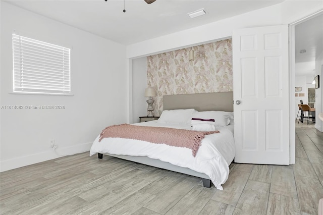 1547 NE 38th St, Oakland Park, FL 33334 - bedroom featuring light wood-style floors, baseboards, and ceiling fan