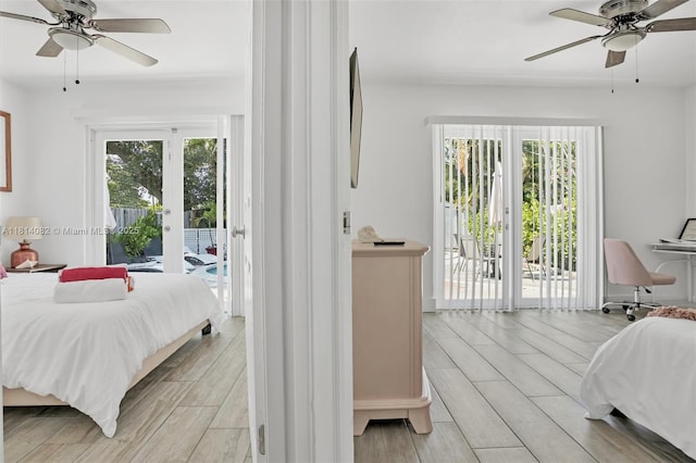 1547 NE 38th St, Oakland Park, FL 33334 - bedroom with access to exterior, french doors, ceiling fan, and light wood-type flooring