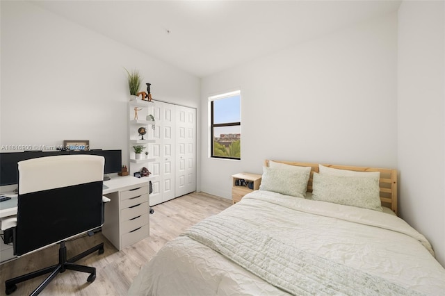 7905 NW 104th Ave Unit 34, Doral, FL 33178 - bedroom featuring light wood-type flooring, an office area, lofted ceiling, and a closet