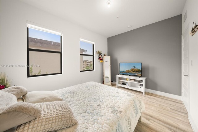 7905 NW 104th Ave Unit 34, Doral, FL 33178 - bedroom with light wood-style flooring and baseboards