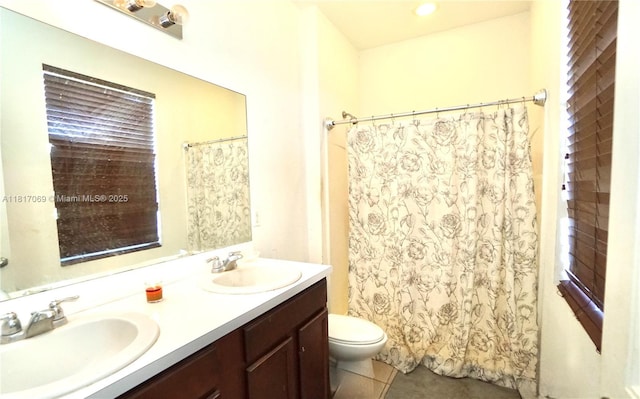 18972 SW 318th Ter, Homestead, FL 33030 - full bathroom with double vanity, tile patterned floors, and a shower with shower curtain