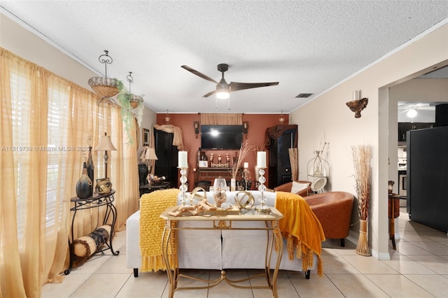 2430 N Dunwoodie Rd, Avon Park, FL 33825 - tiled living room featuring ceiling fan, crown molding, and a textured ceiling